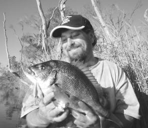The author about to return a 44cm bream caught on a hard body.